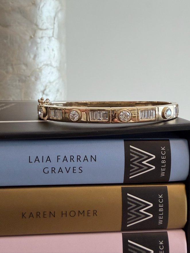 Diamond bangle on a stack of books